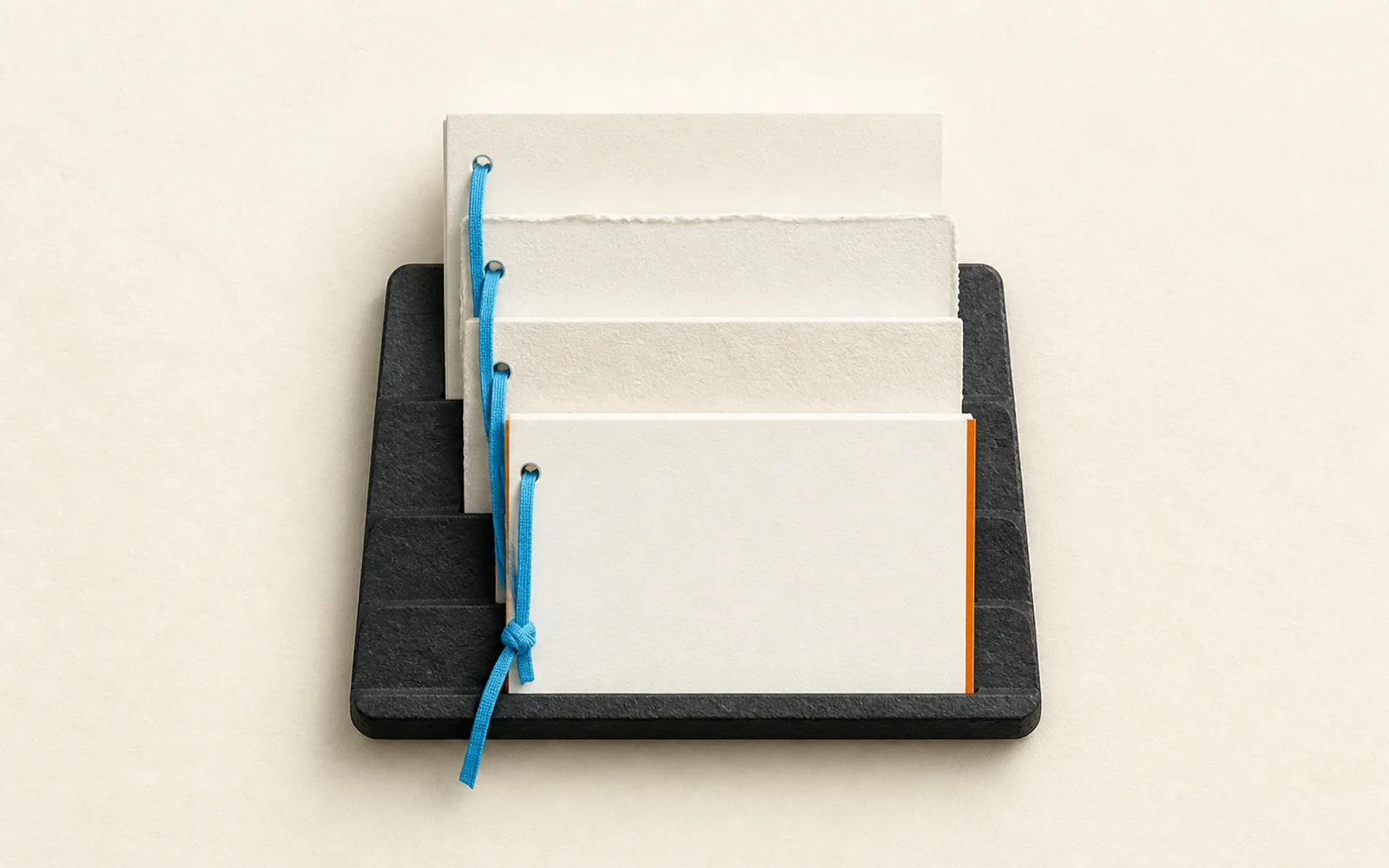 Four blank document panels advance through a bound revision cradle, with the newest panel highlighted in orange.